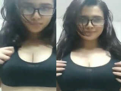 Gorgeous Desi student wears glasses and squeezes her massive natural XXX boobs