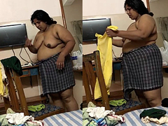 Fat Desi woman is changing clothes at home while her man is filming the XXX