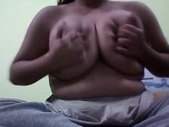 Indian woman with massive boobs and a fat XXX belly is all alone in the room