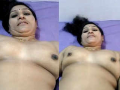Gorgeous Desi aunty with juicy natural boobs and a fat ass taking some XXX pics